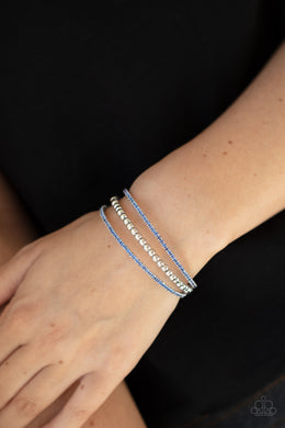 High-End Eye Candy - Blue Rhinestone Cuff Bracelet Paparazzi Accessories